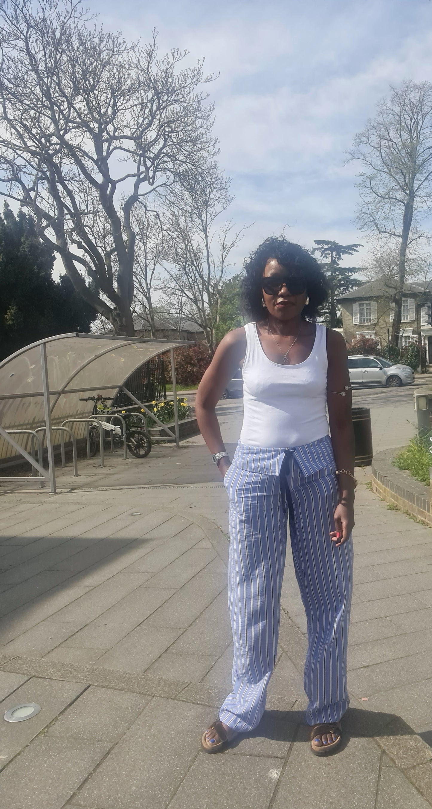 Stripped trousers with turn down waist