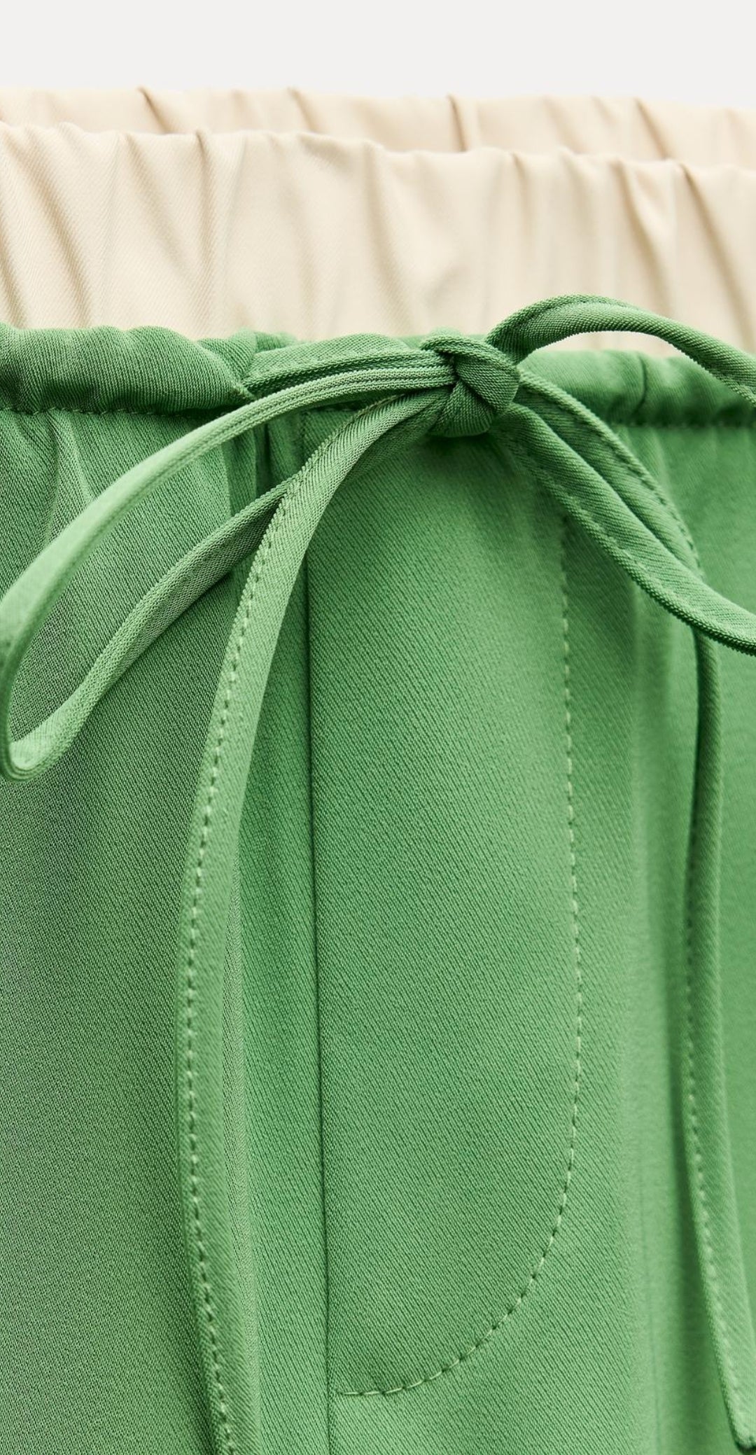 Draw string trousers with side pipping