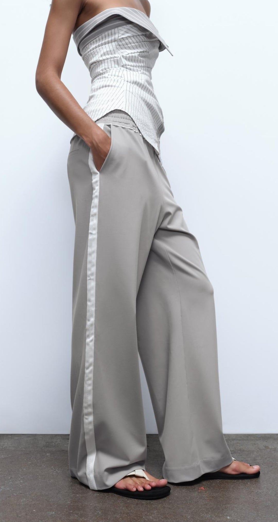 Trousers with side taping
