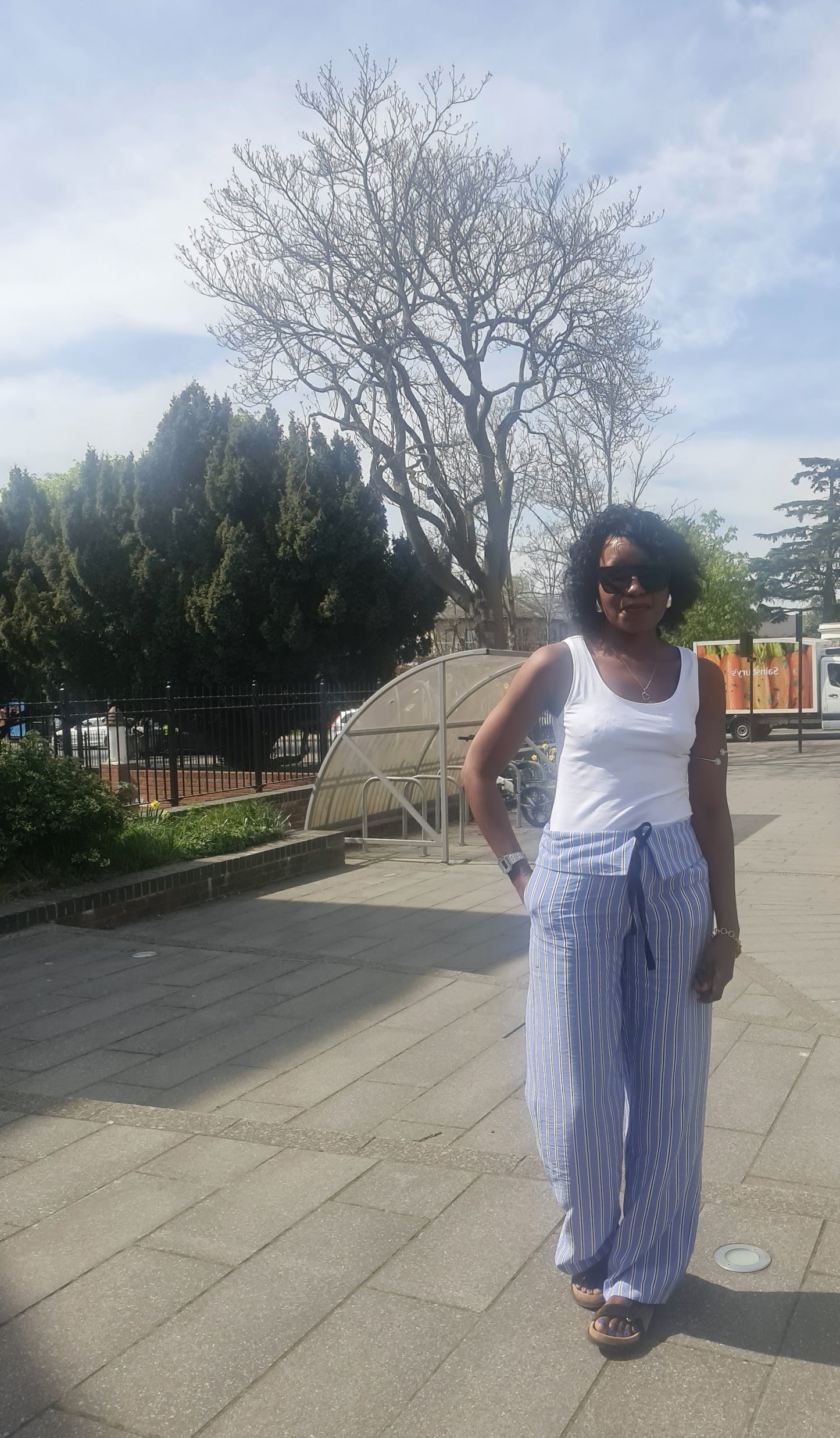 Stripped trousers with turn down waist