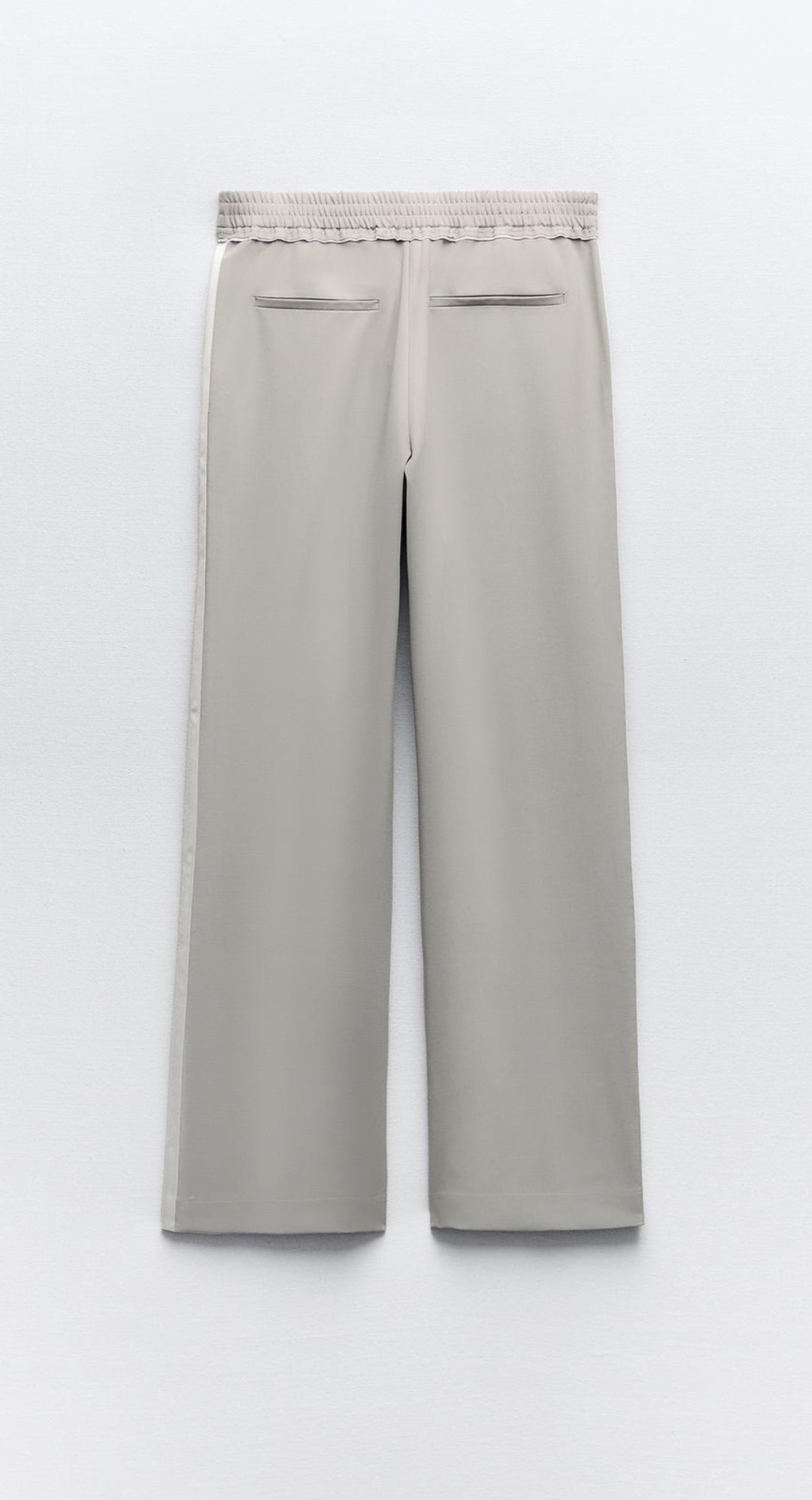 Trousers with side taping