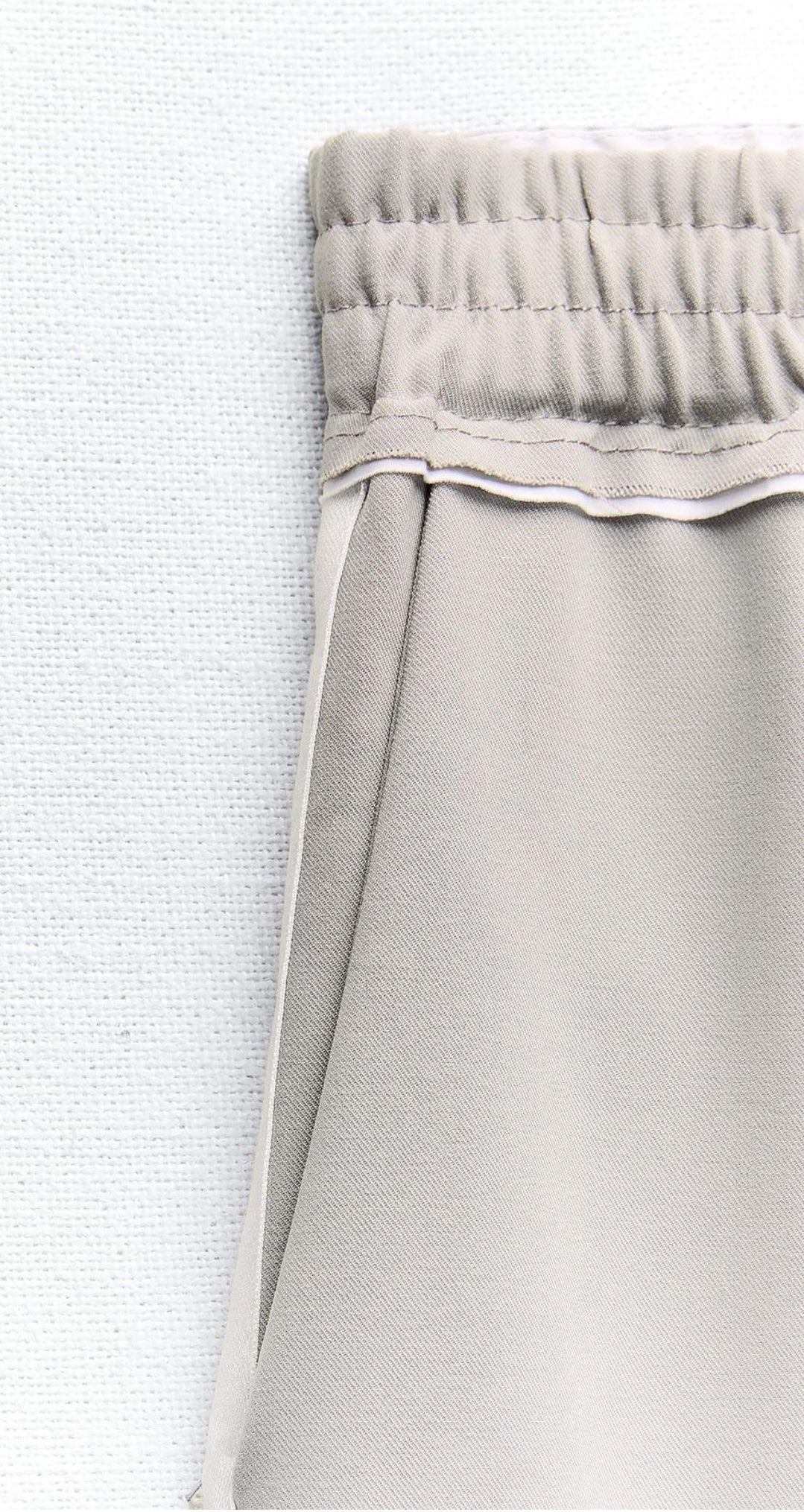 Trousers with side taping