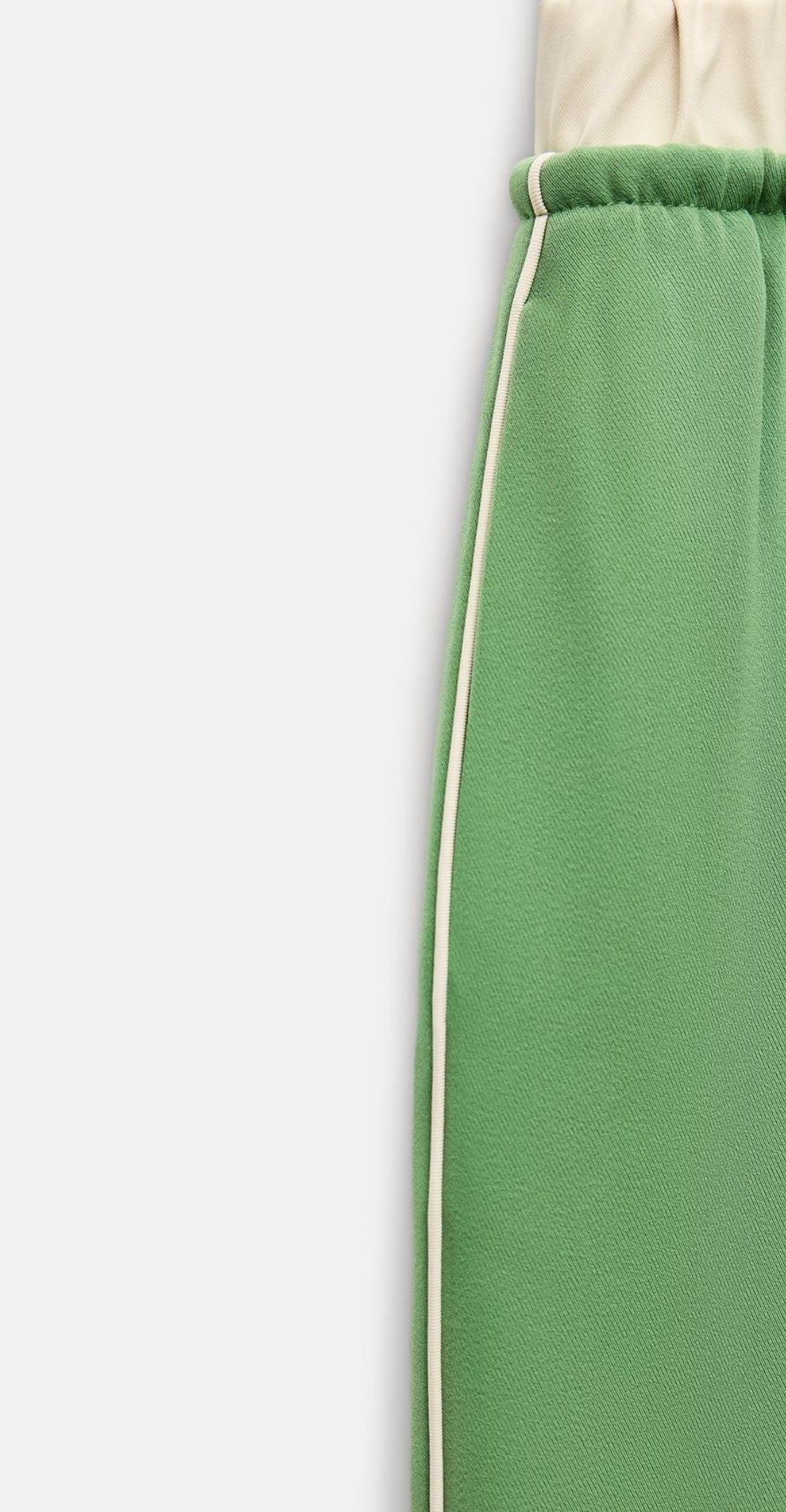 Draw string trousers with side pipping