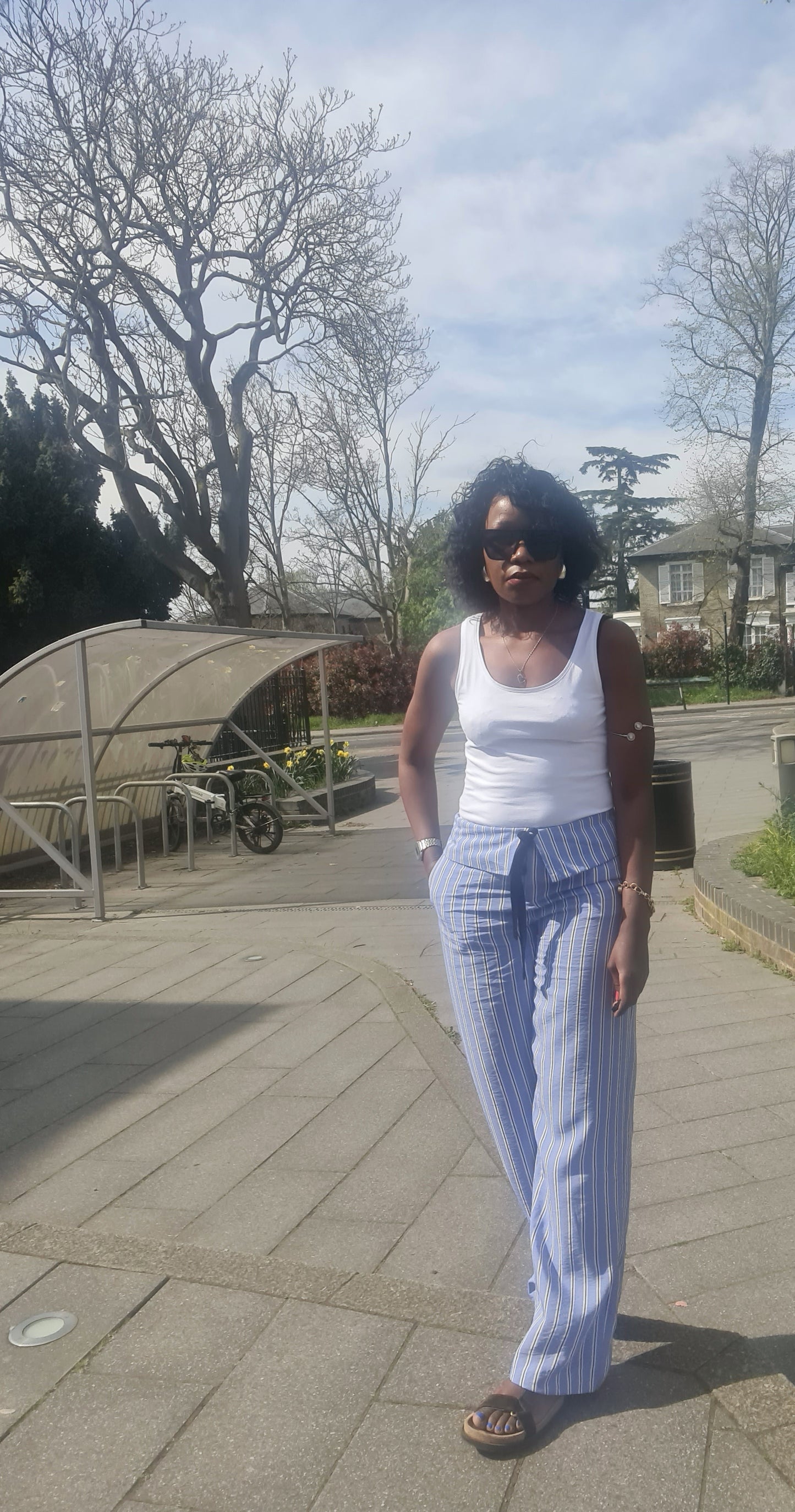 Stripped trousers with turn down waist
