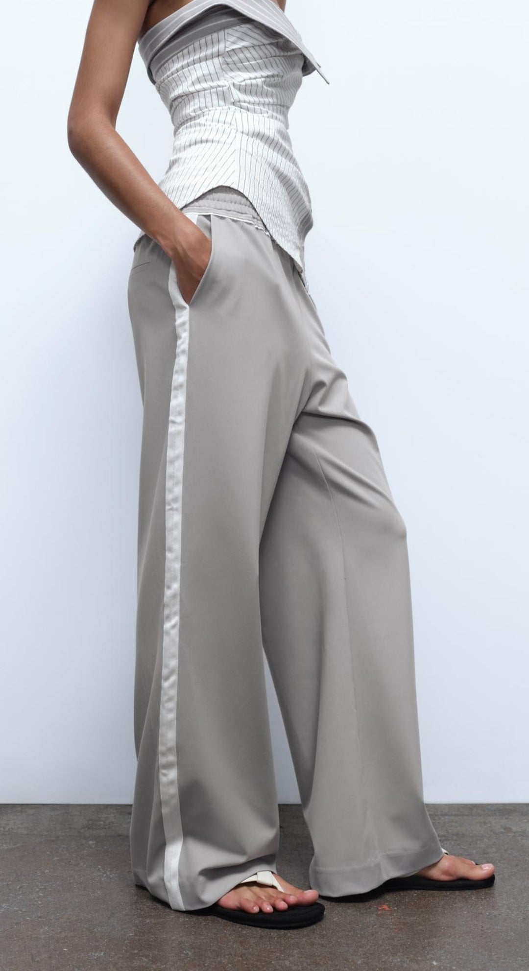 Trousers with side taping